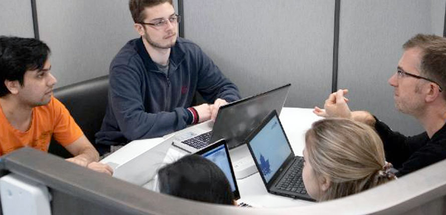 VERiS team members working at a table